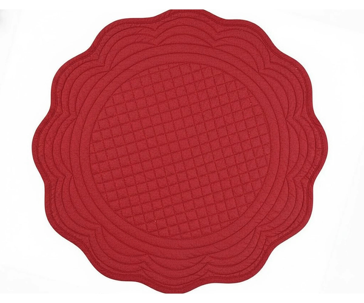 Red round scalloped placemat made from quilted cotton with elegant stitched texture for festive and farmhouse table décor Red round scalloped placemat made from quilted cotton with elegant stitched texture for festive and farmhouse table décor