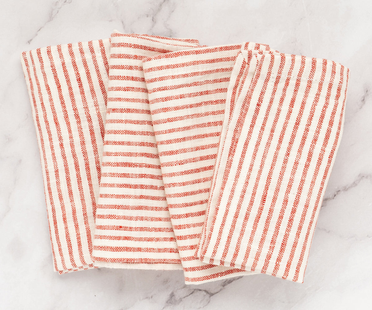 Red striped napkins folded and stacked for storage or display Red striped napkins folded and stacked for storage or display