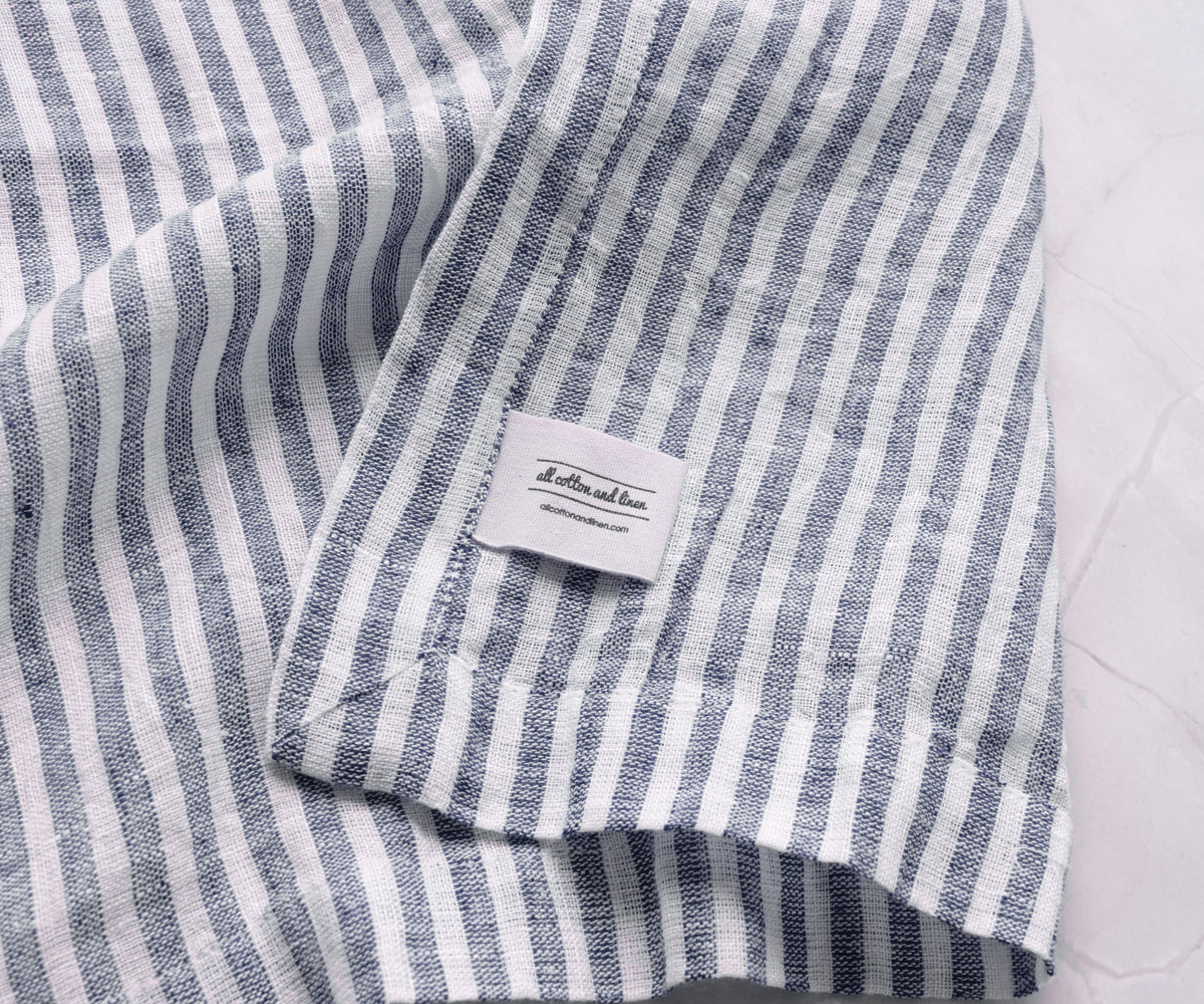 Reusable navy blue linen napkins from All Cotton and Linen offering a sustainable alternative to disposable paper napkins. Reusable navy blue linen napkins from All Cotton and Linen offering a sustainable alternative to disposable paper napkins.