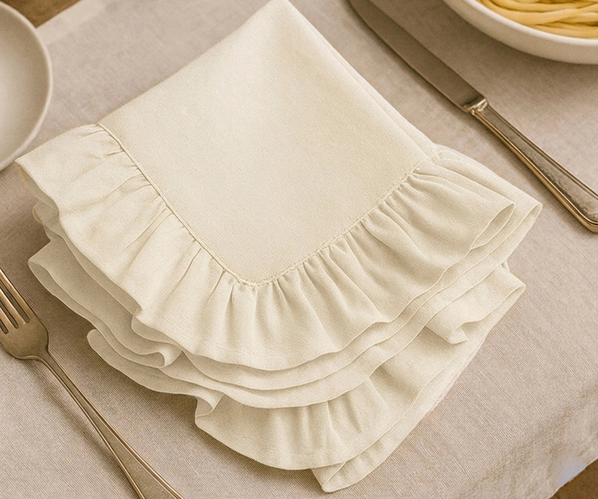 Reusable ivory cotton dinner napkins with soft fabric and decorative ruffle trim for farmhouse dining and holiday table décor Reusable ivory cotton dinner napkins with soft fabric and decorative ruffle trim for farmhouse dining and holiday table décor