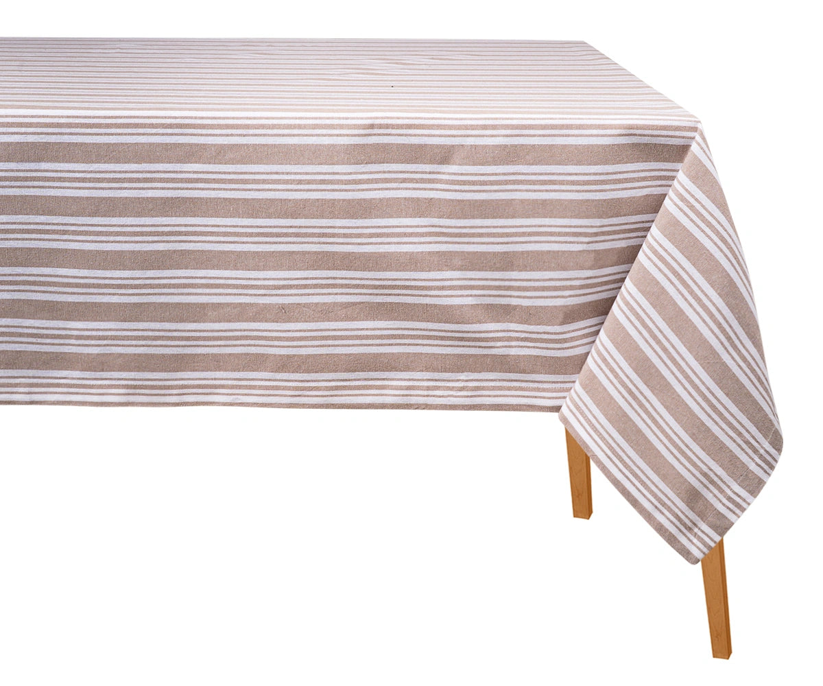 Beige and white striped cotton tablecloth draped over a wooden dining table against a plain white background. Beige and white striped cotton tablecloth draped over a wooden dining table against a plain white background.