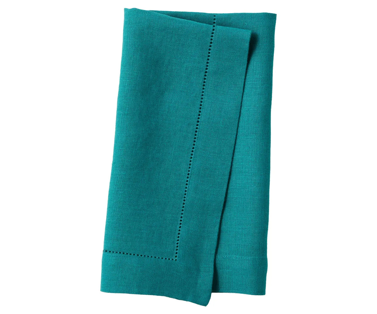 Eco-friendly linen napkin set folded and ready for event planners or catering. Eco-friendly linen napkin set folded and ready for event planners or catering.