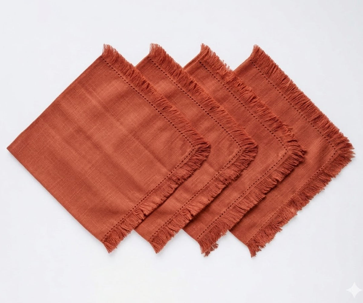 Eco-friendly cotton napkins with relaxed fringe edges, a practical alternative to disposable paper napkins. Eco-friendly cotton napkins with relaxed fringe edges, a practical alternative to disposable paper napkins.
