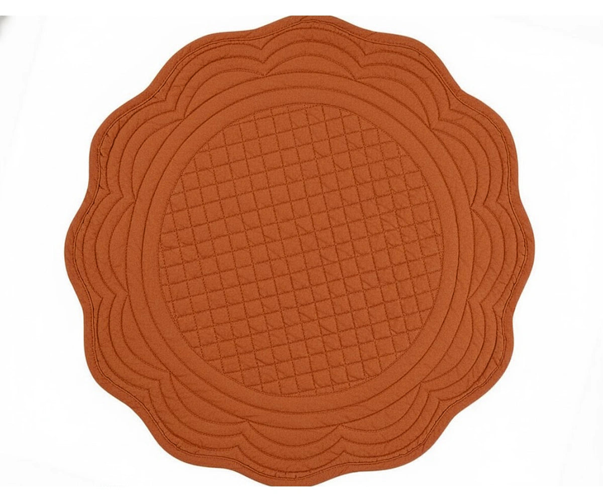 Terracotta round scalloped placemat made of quilted cotton for warm rustic and farmhouse table styling Terracotta round scalloped placemat made of quilted cotton for warm rustic and farmhouse table styling
