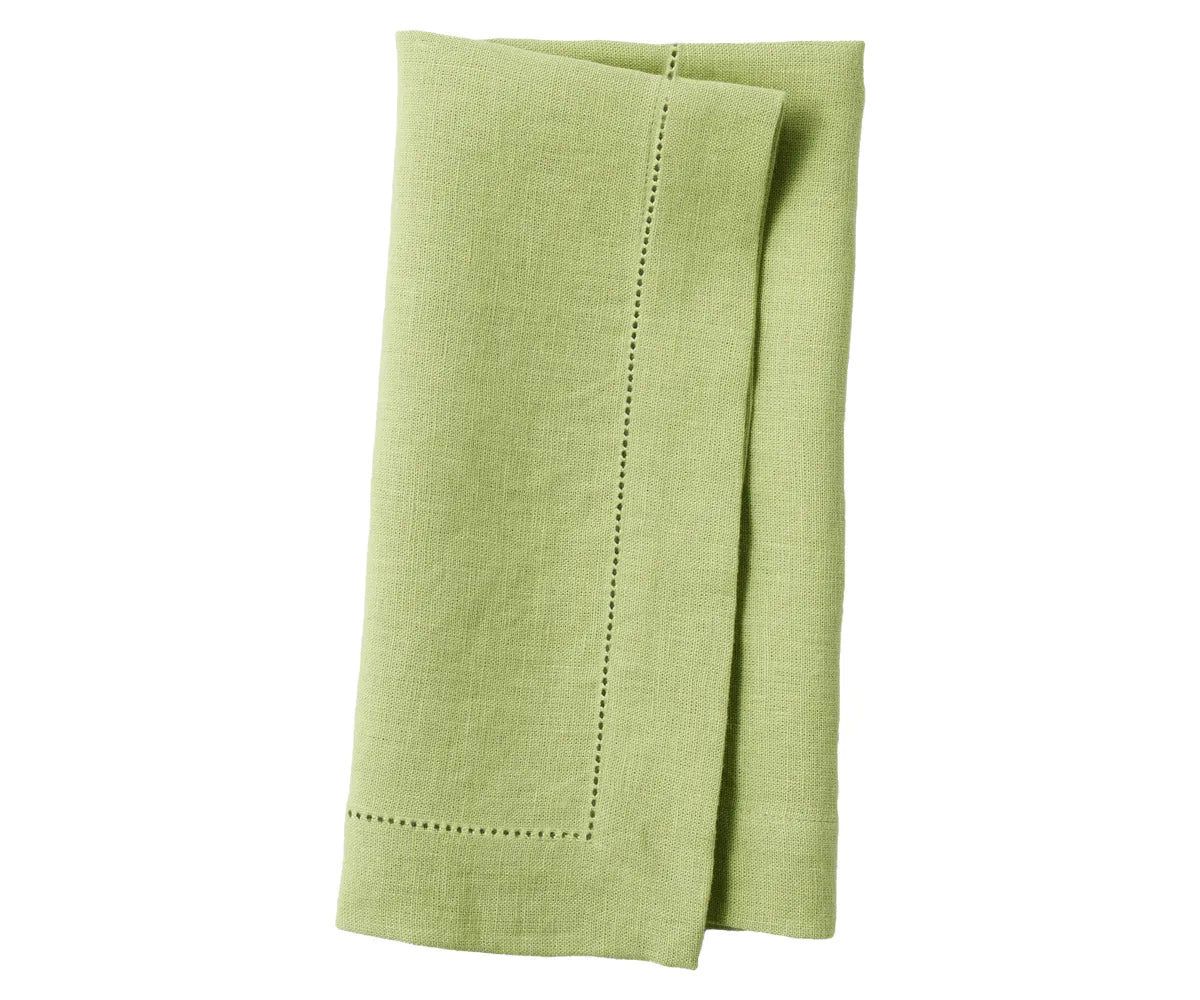 Packaged linen napkin set with care label, showcasing sustainable home goods. Packaged linen napkin set with care label, showcasing sustainable home goods.