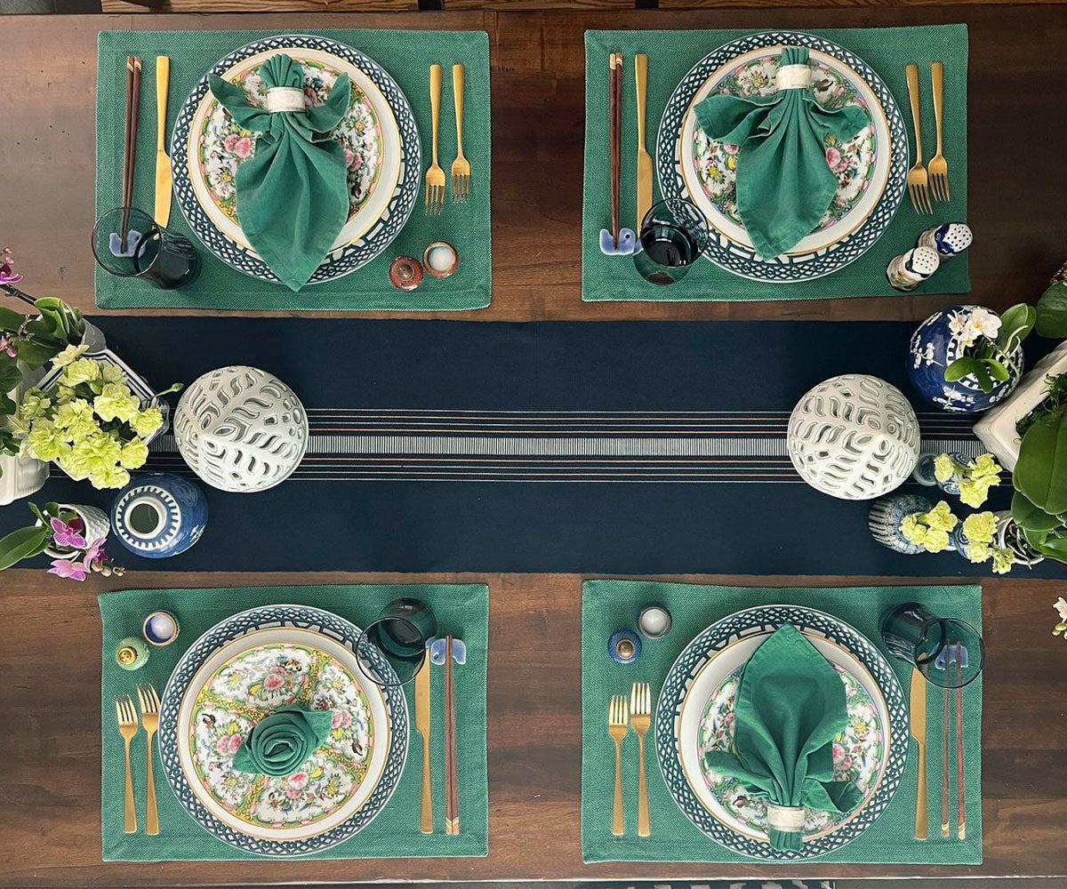 Upgrade your table decor with green fabric placemats, adding a touch of charm and protection, perfect for enjoyable dining moments. Upgrade your table decor with green fabric placemats, adding a touch of charm and protection, perfect for enjoyable dining moments.