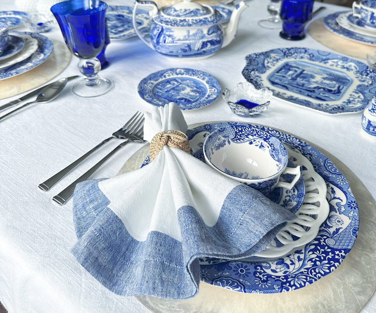 High-quality white napkins on a rustic table setting for a dinner party High-quality white napkins on a rustic table setting for a dinner party