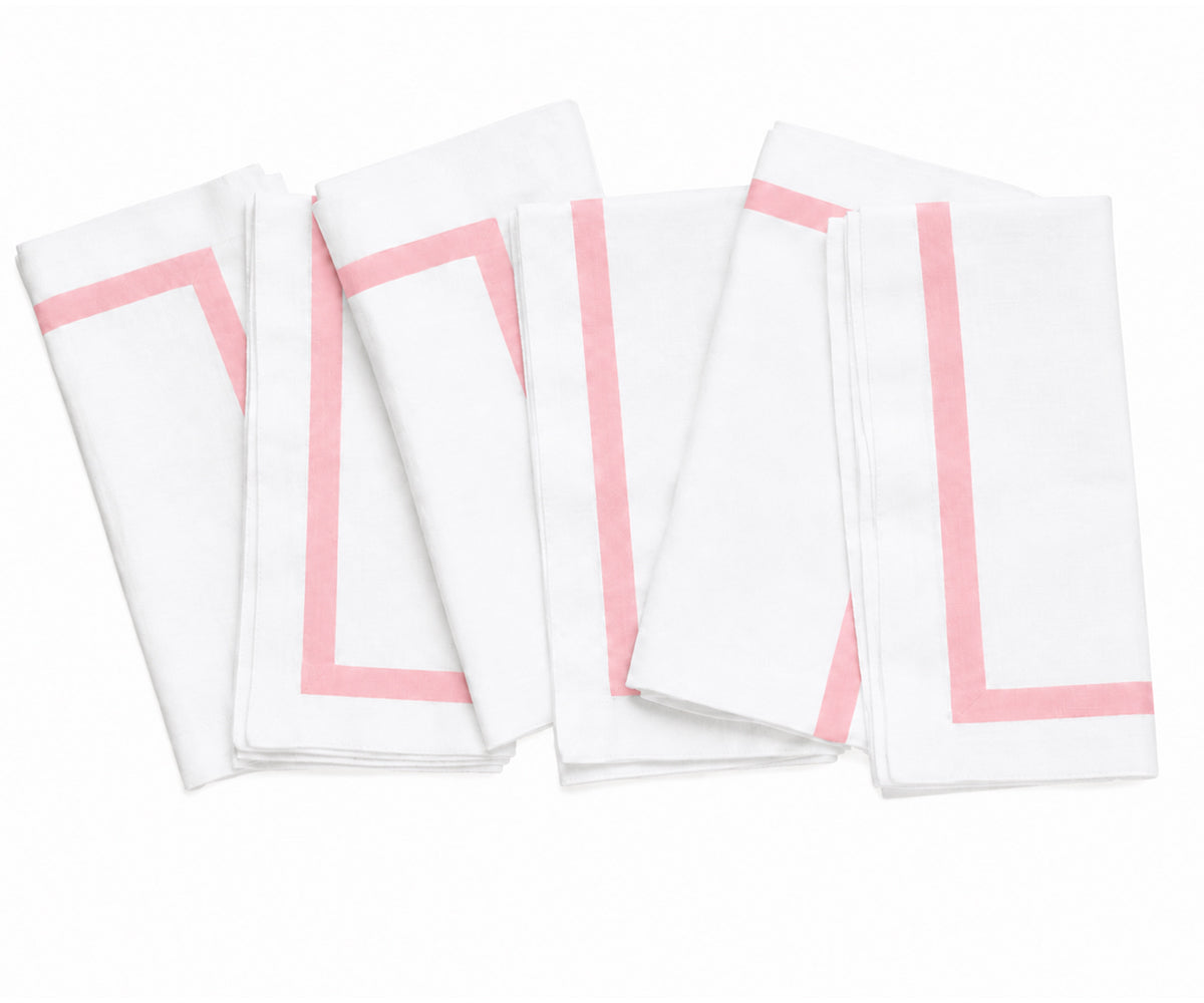 Elegant cloth dinner napkin in white with a colorful border, styled for a refined and coordinated tablescape. Elegant cloth dinner napkin in white with a colorful border, styled for a refined and coordinated tablescape.