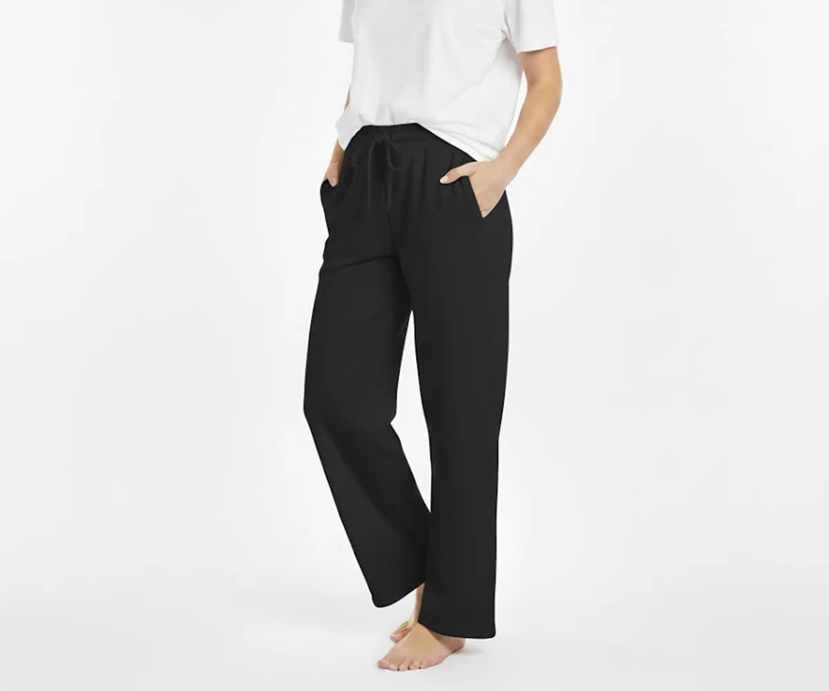 Women’s relaxed-fit black cotton pants with lightweight, breathable fabric for everyday comfort. Women’s relaxed-fit black cotton pants with lightweight, breathable fabric for everyday comfort.