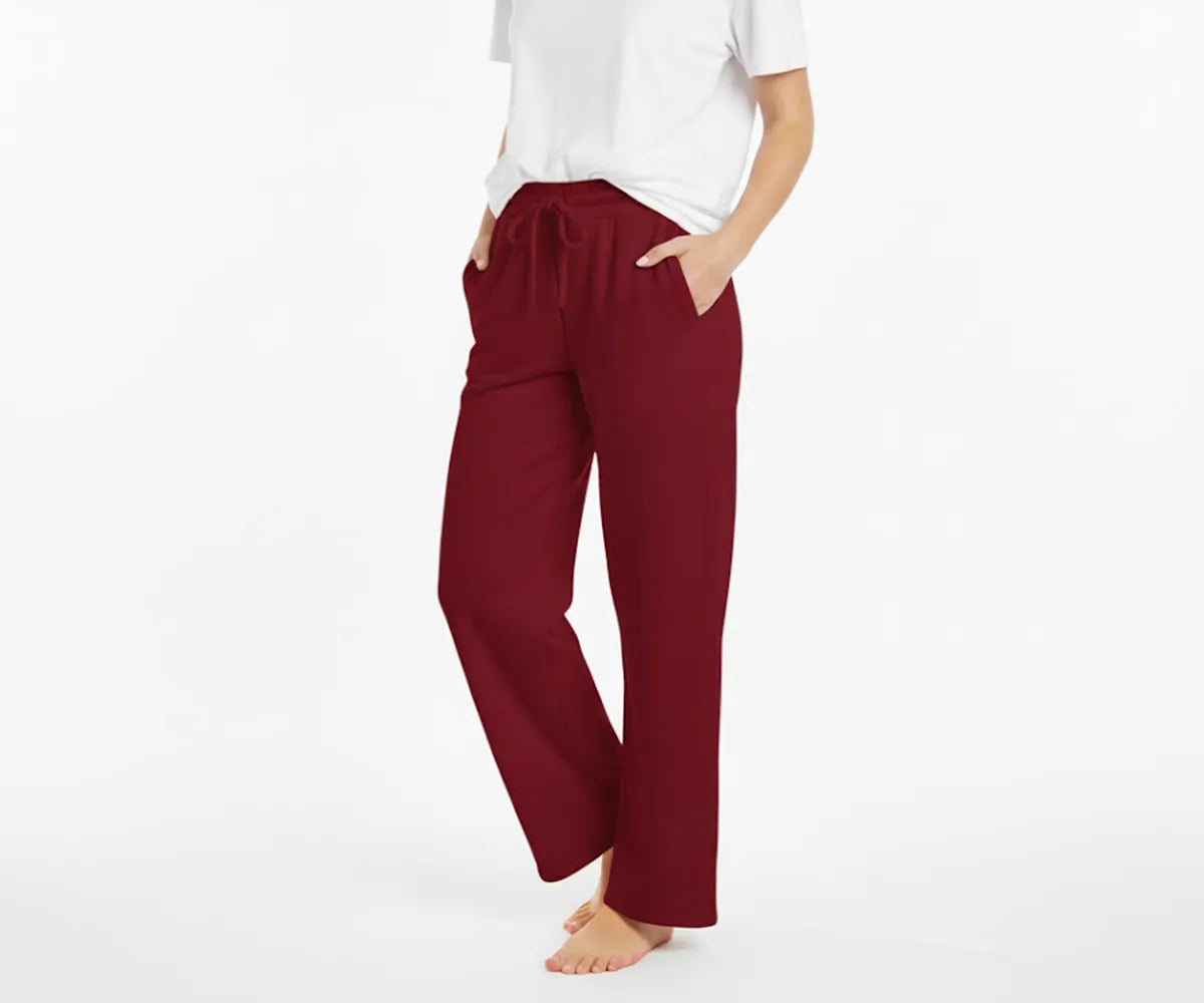 Women’s relaxed-fit wine red cotton pants featuring a flowy, comfortable design for daily use. Women’s relaxed-fit wine red cotton pants featuring a flowy, comfortable design for daily use.
