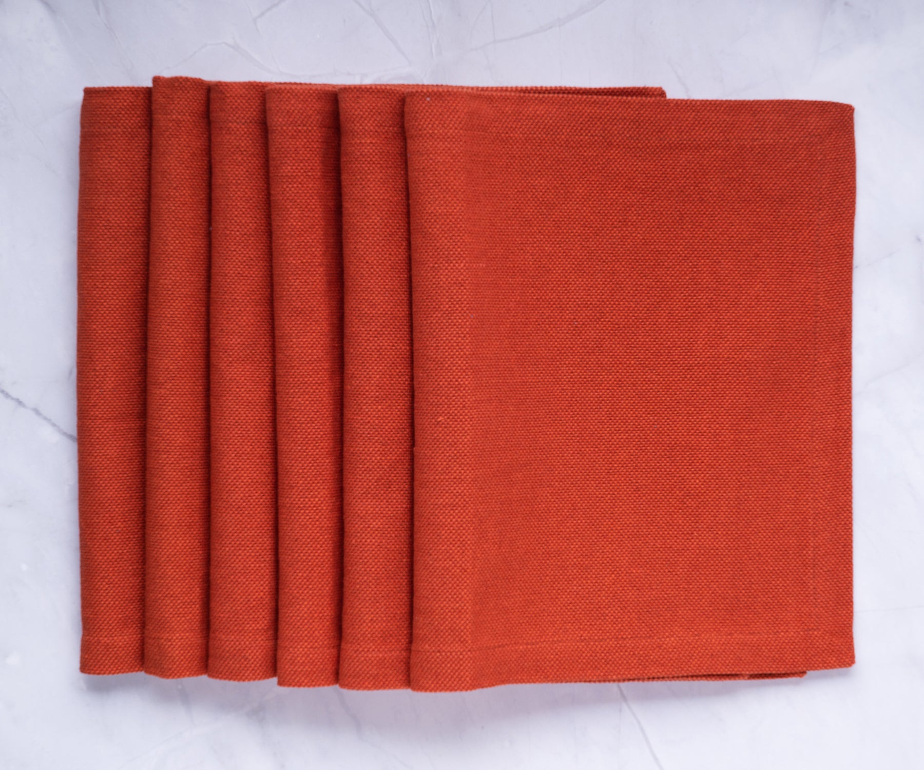 Protect and adorn your dining table with red fabric placemats, adding a touch of elegance to your mealtimes. Protect and adorn your dining table with red fabric placemats, adding a touch of elegance to your mealtimes.