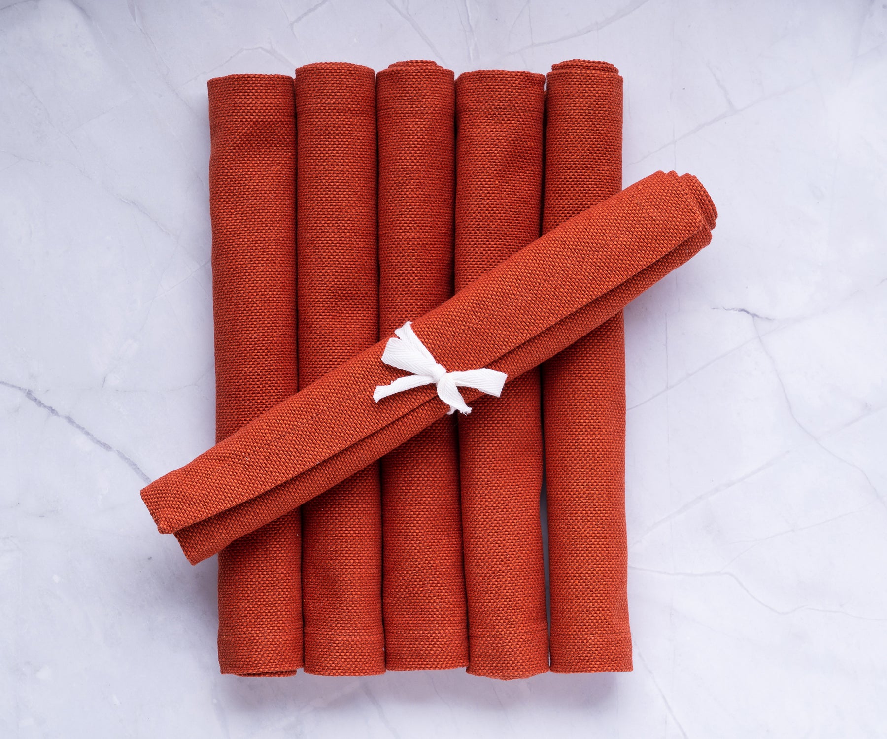Elevate your dining ambiance with stylish red fabric placemats, providing both protection and sophistication to your table setting Elevate your dining ambiance with stylish red fabric placemats, providing both protection and sophistication to your table setting