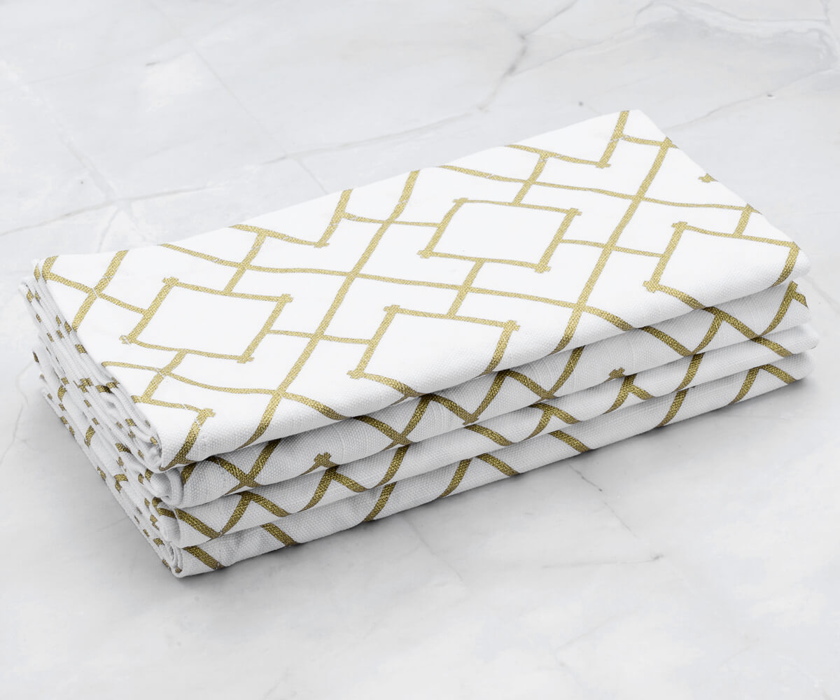 Folded set of 4 Cotton napkins - gold dinner napkins  are arranged one above another.(cloth dinner napkins) Folded set of 4 Cotton napkins - gold dinner napkins  are arranged one above another.(cloth dinner napkins)