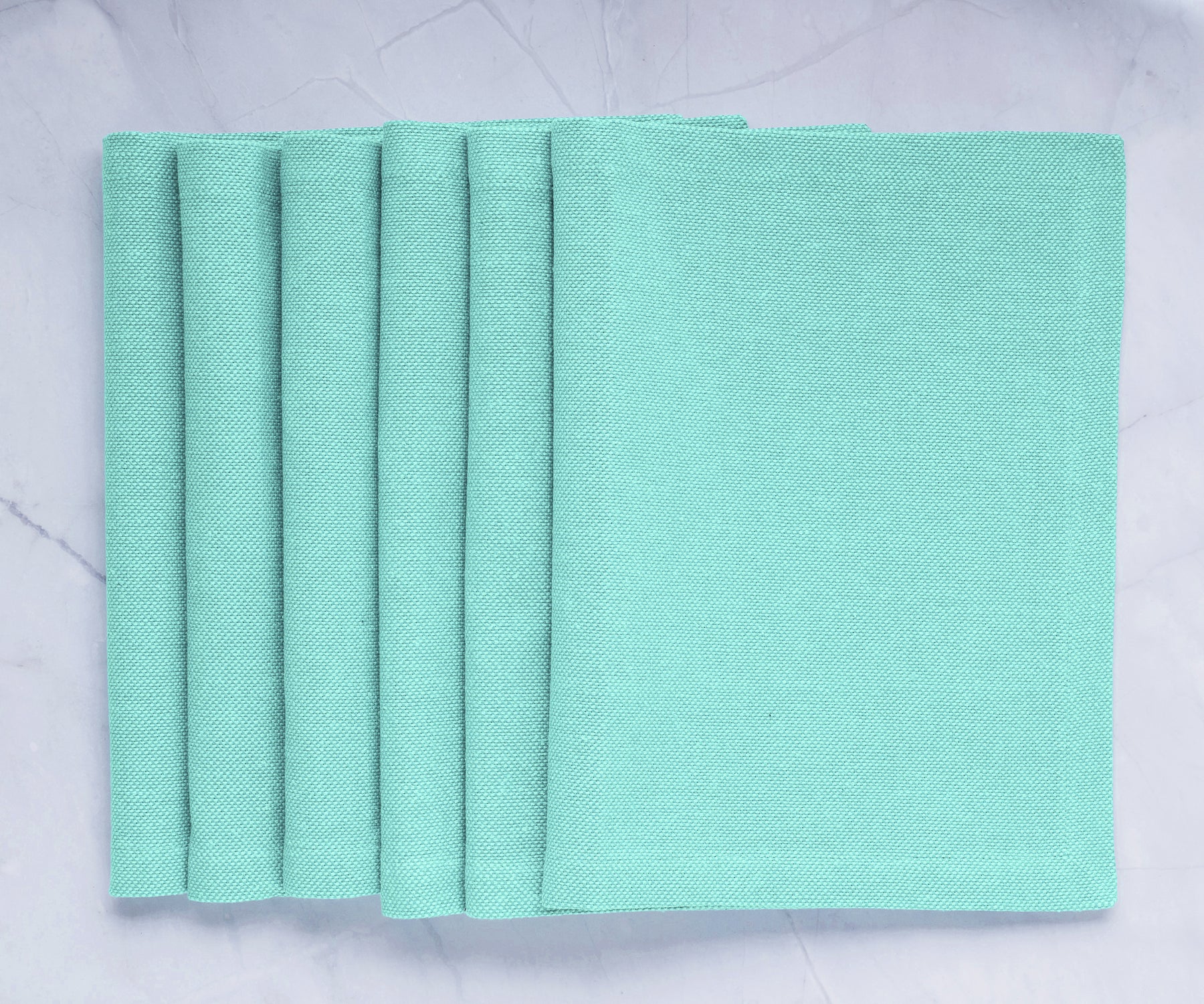 Green fabric placemats: Elevate your dining table with charm and protection, bringing style and practicality to your meals.  Green fabric placemats: Elevate your dining table with charm and protection, bringing style and practicality to your meals.