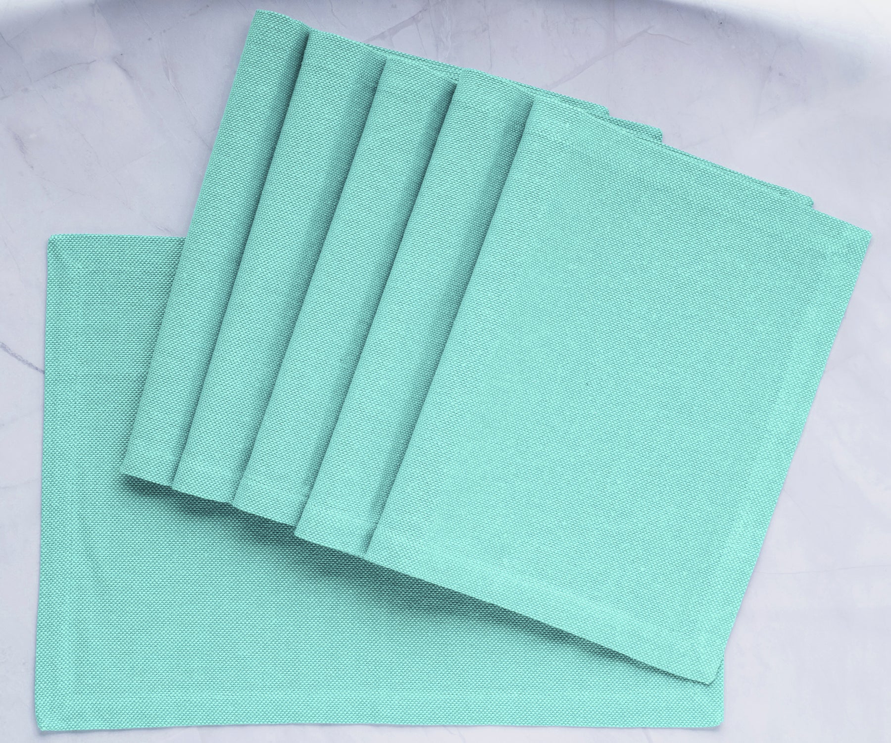 Transform your dining table with green fabric placemats, providing charm and protection for a delightful and stylish mealtime upgrade. Transform your dining table with green fabric placemats, providing charm and protection for a delightful and stylish mealtime upgrade.