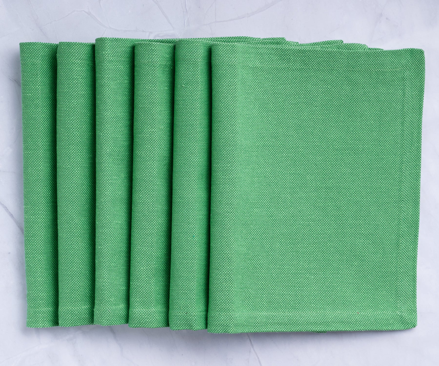 Revamp your table with green fabric placemats, adding charm and protection for a delightful dining experience. Elevate your meals today! Revamp your table with green fabric placemats, adding charm and protection for a delightful dining experience. Elevate your meals today!