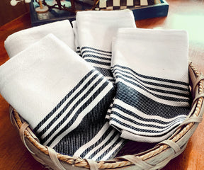 black striped towels - They are typically made from absorbent fabrics such as cotton or linen 