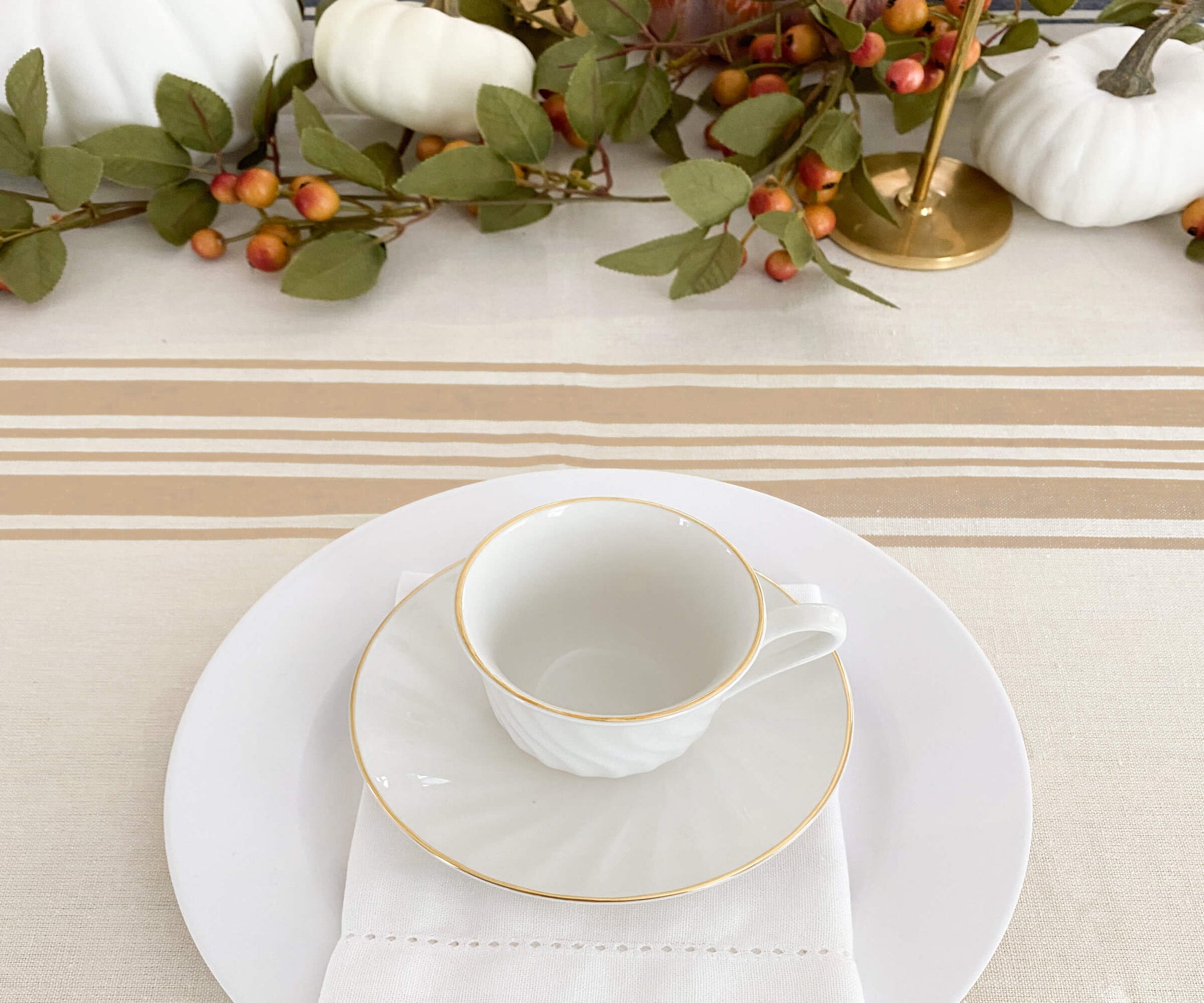 Farmhouse tablecloth with golden cup on top