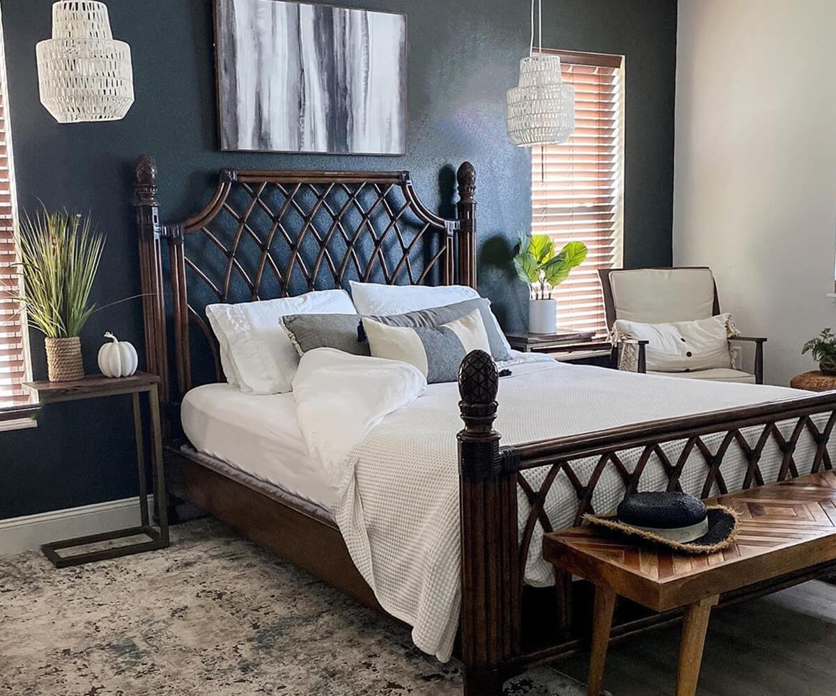 A bedroom showcasing the cotton fitted sheet on a wooden bed