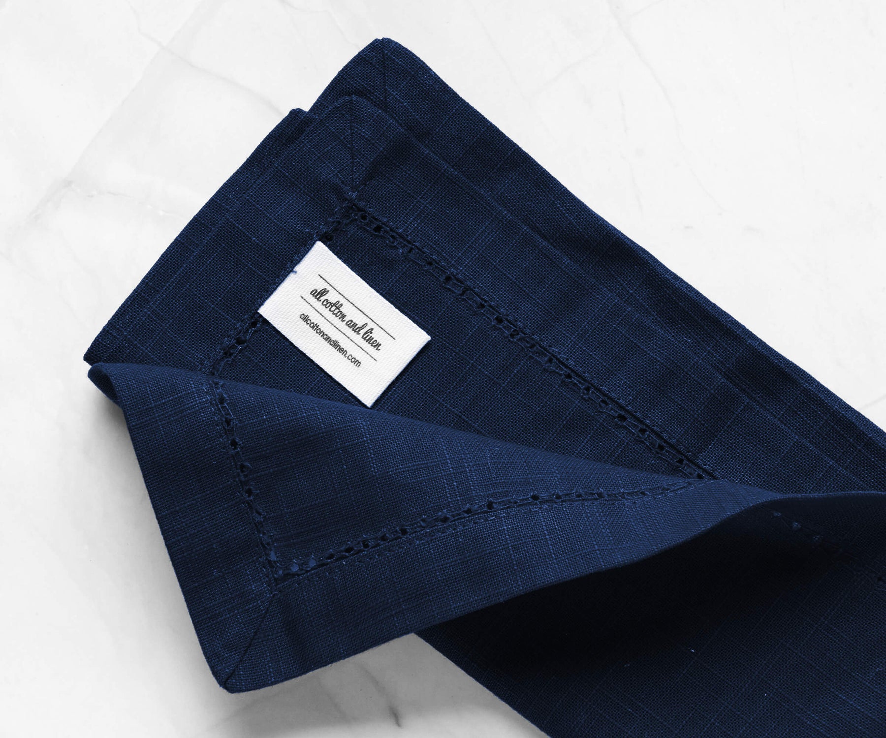 Hemstitched folded navy blue cloth napkins, easter linen dinner napkins with 1 Hemstitched folded navy blue cloth napkins, easter linen dinner napkins with 1" borders with the label of All cotton and linen.
