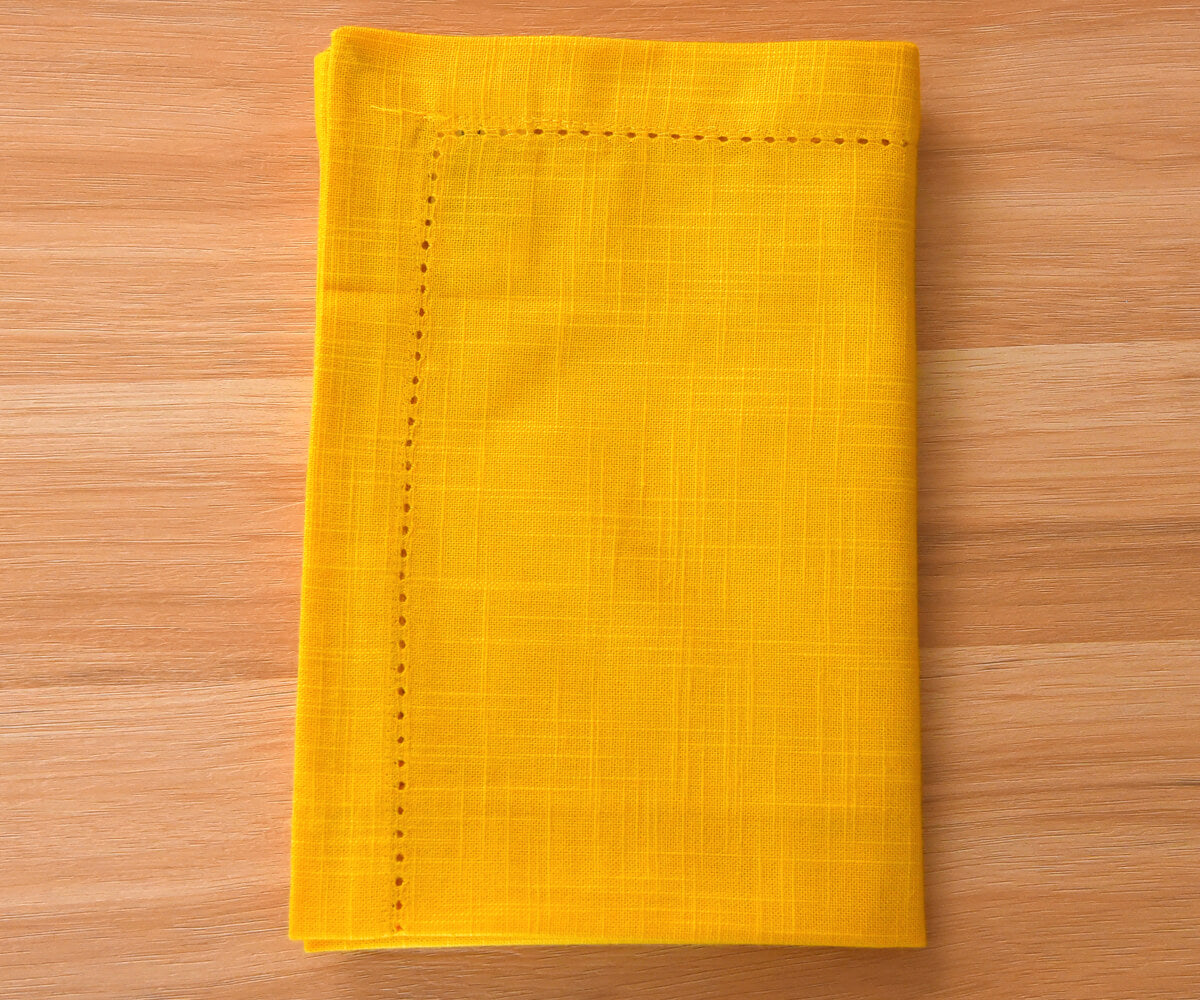 yellow napkins cloth washable with 1-inch border and small folding on floor. yellow napkins cloth washable with 1-inch border and small folding on floor.