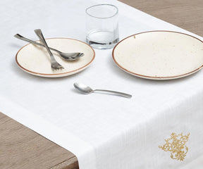 The white table runner can be used for everyday meals. embriodered beige table runners