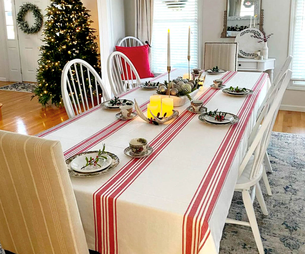 Dining table adorned with red and white striped Farmhouse tablecloth Dining table adorned with red and white striped Farmhouse tablecloth
