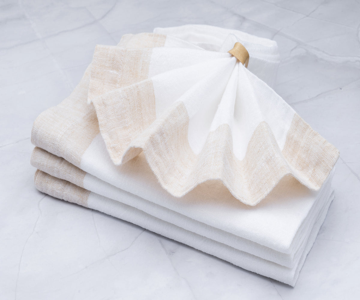 Immaculate white dinner napkins displayed on a formal dining table