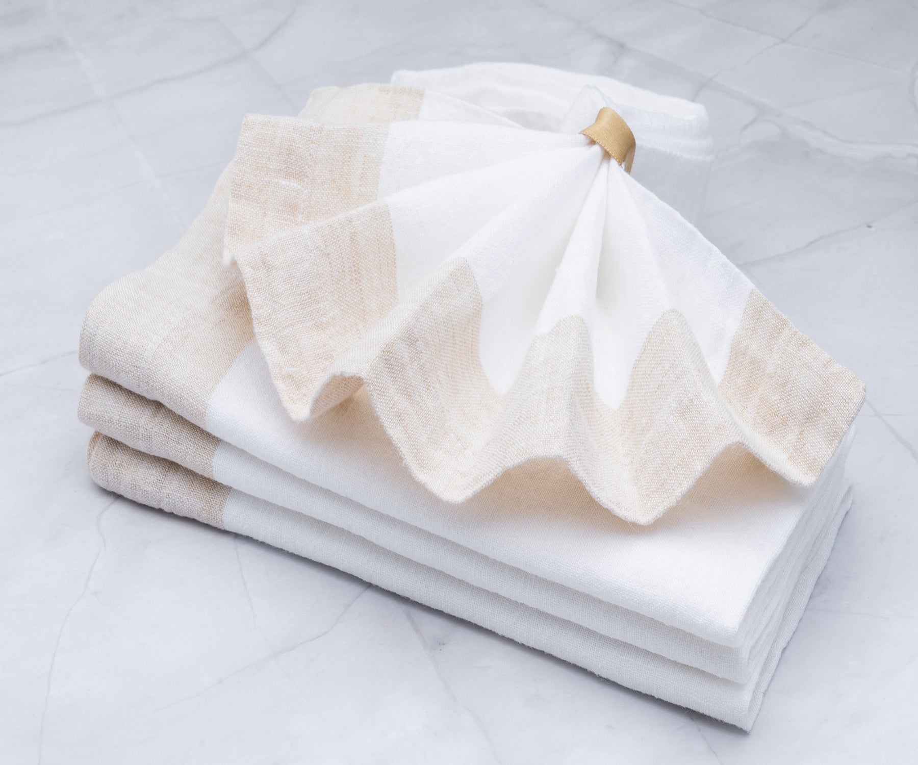 Crisp and pristine white linen napkins, offering a classic and sophisticated look for any occasion. Crisp and pristine white linen napkins, offering a classic and sophisticated look for any occasion.
