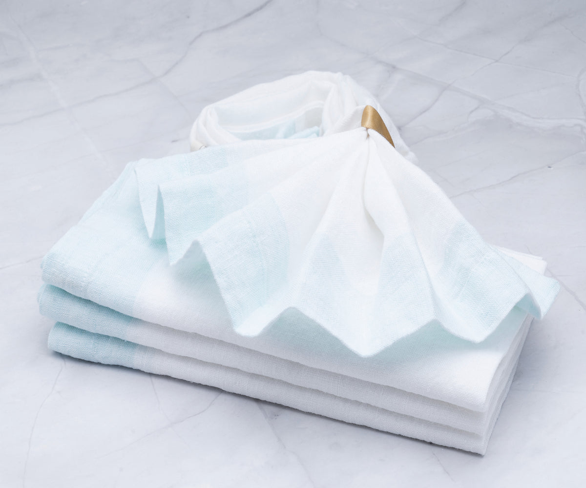 A bulk pack of cream cloth napkins for restaurant use A bulk pack of cream cloth napkins for restaurant use