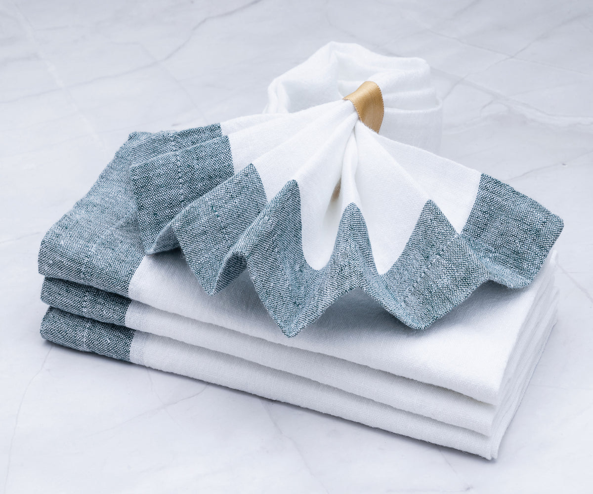 Refreshing green linen napkins, bringing a touch of nature's beauty to your table decor. Refreshing green linen napkins, bringing a touch of nature's beauty to your table decor.