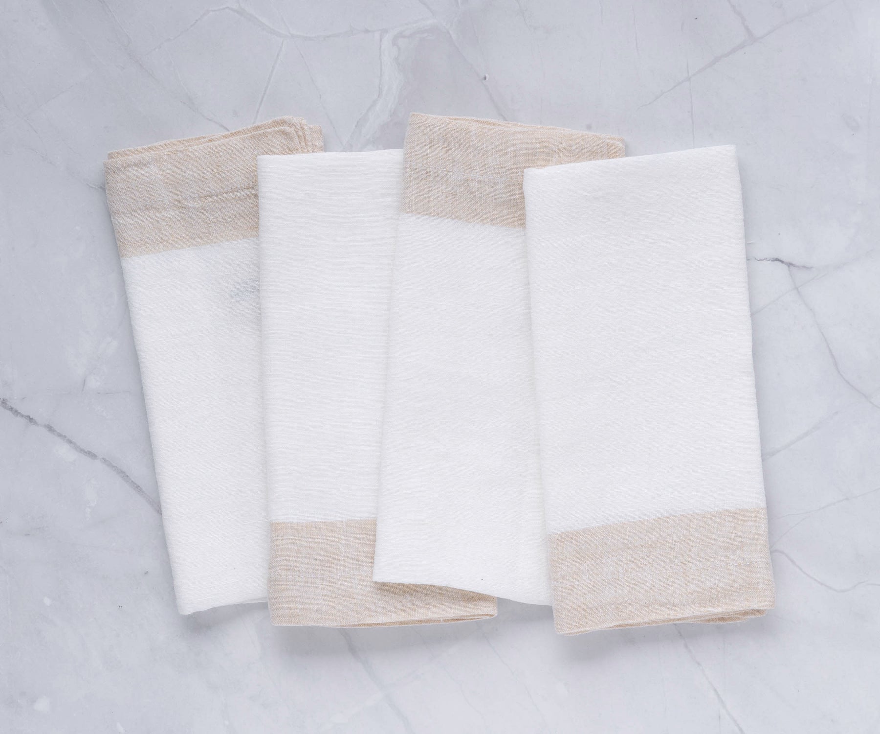 A single refined linen napkin, exuding understated luxury for your dining experience. A single refined linen napkin, exuding understated luxury for your dining experience.