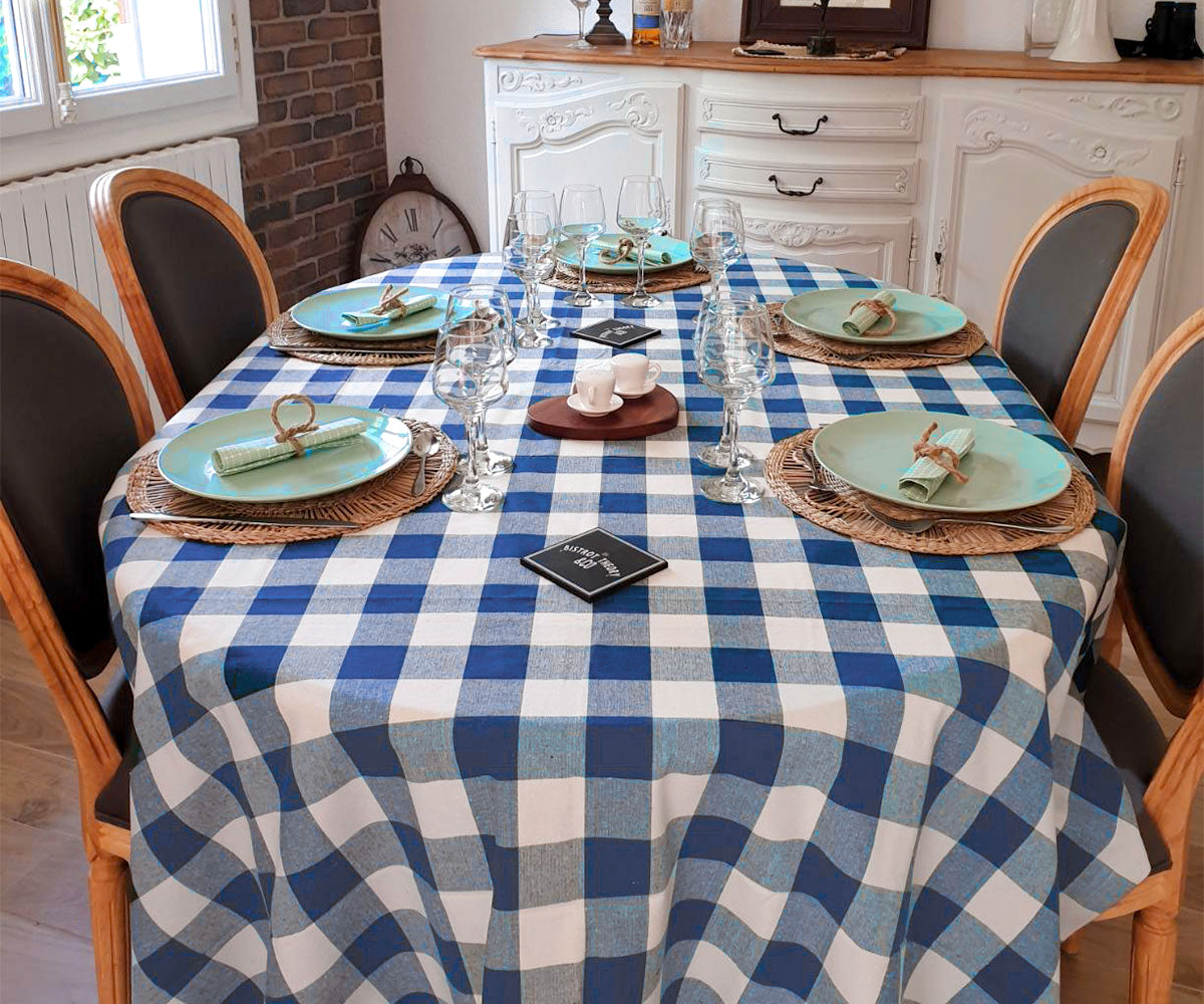 Easter table decor ideas with Blue tablecloth , woven placemats and plates in a simple and pleasant way.