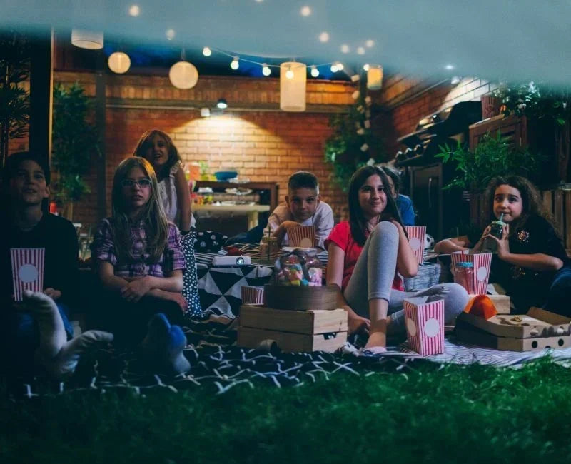 Outdoor Halloween party decorated with pumpkins, spooky accents, festive lighting, and themed activities.
