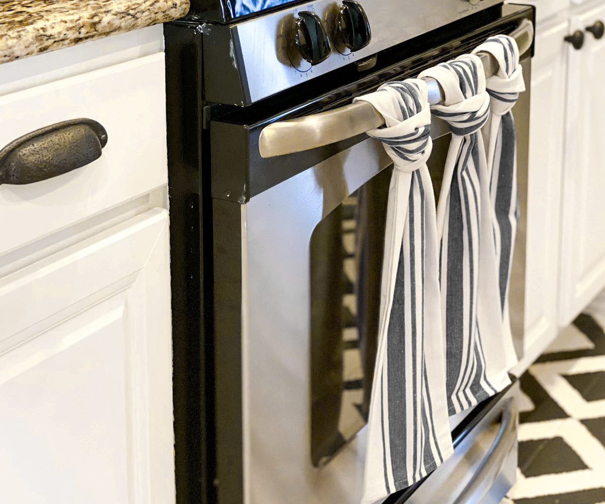 Navy and white striped dish towels add a touch of farmhouse style to your kitchen