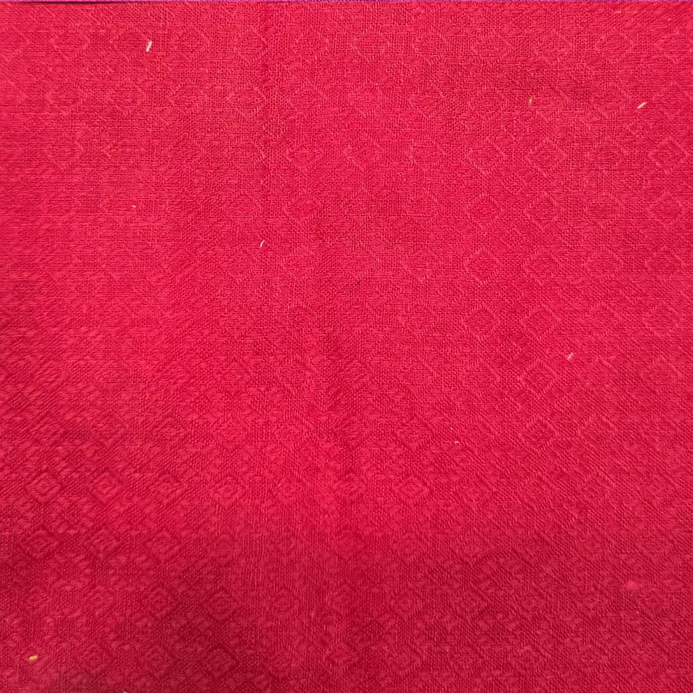 Bright red textured fabric close-up