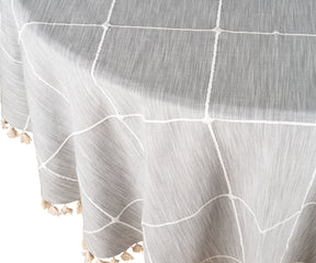 A cotton round tablecloth with a rustic burlap texture, adding a natural touch to the setting.