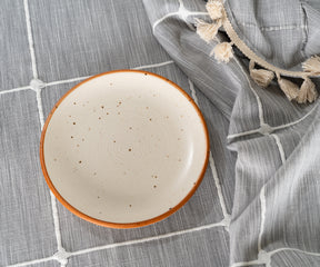 gray round tablecloth with a matte finish, offering a modern and sophisticated look.