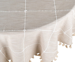 A soft beige round tablecloth with a minimalist design, complementing modern decor.
