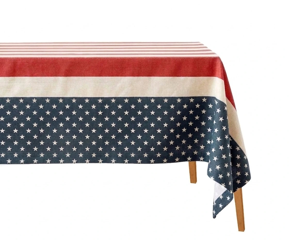 Patriotic Fourth of July tablecloth with stars and stripes design in red, white, and blue for Independence Day dining table decor