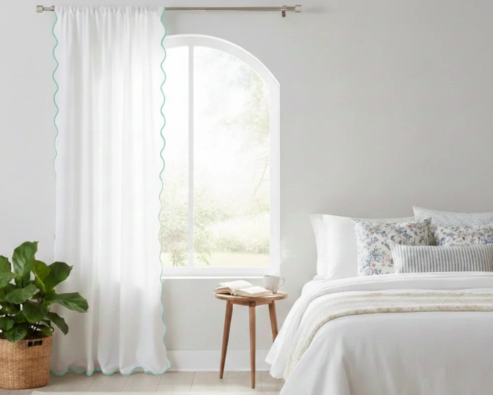 White curtain with Aqua Blue wavy side trim in a bedroom setting