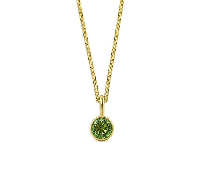 Minimalist women’s peridot necklace on white background