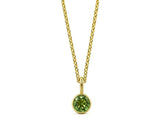 Minimalist women’s peridot necklace on white background