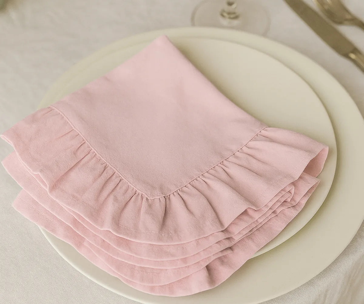 Set of cotton ruffle napkins in baby pink, reusable and absorbent fabric dinner napkins available in multiple sizes, ideal for rustic farmhouse décor, elegant tablescapes, and special occasions.