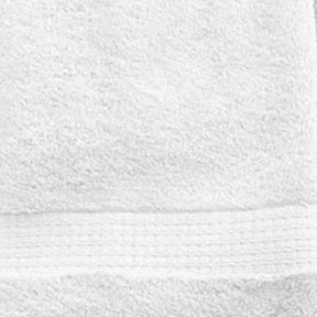 Stacked white bath towels crafted from 100% cotton terry