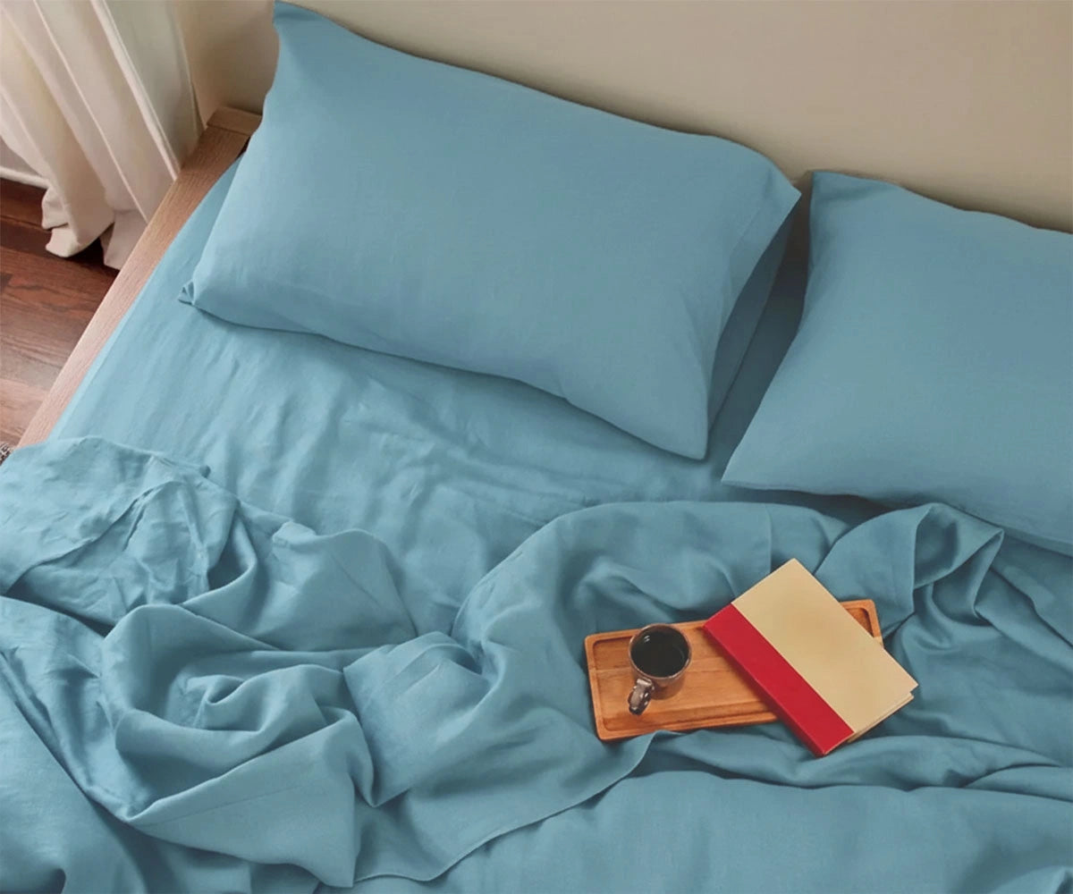 Soft sky blue linen fitted sheet with matching pillowcases, breathable natural linen bedding for modern bedroom décor