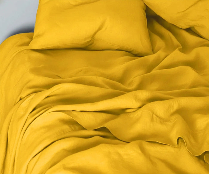 Mustard yellow linen bed sheets set made from 100% European flax with breathable fabric and deep pocket fitted sheet