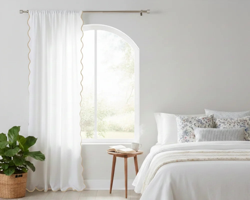 Bright bedroom with white curtains featuring tan wavy side trim