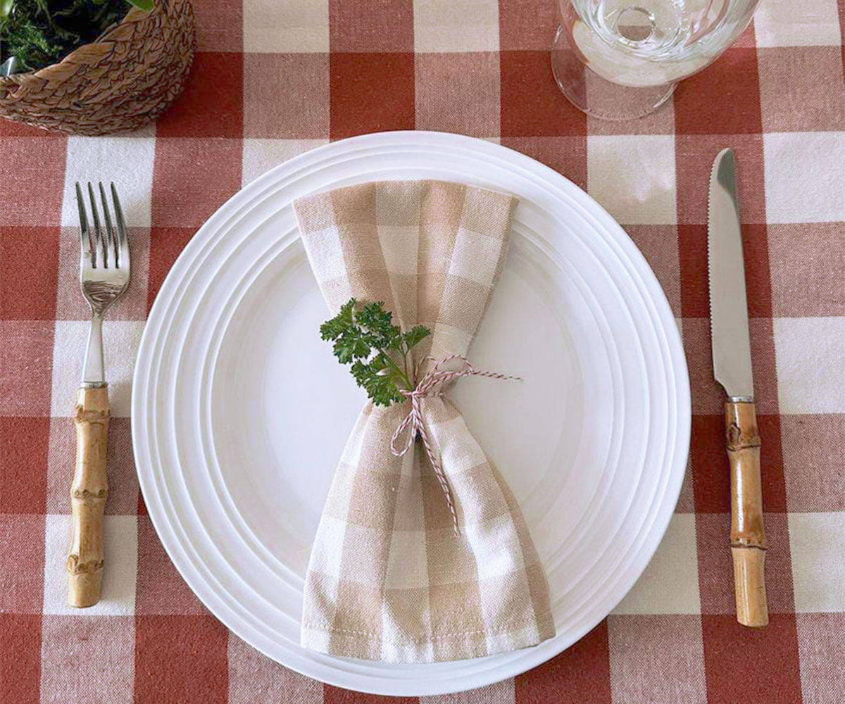 Buffalo plaid napkins taupe, a trendy addition to your dining decor.