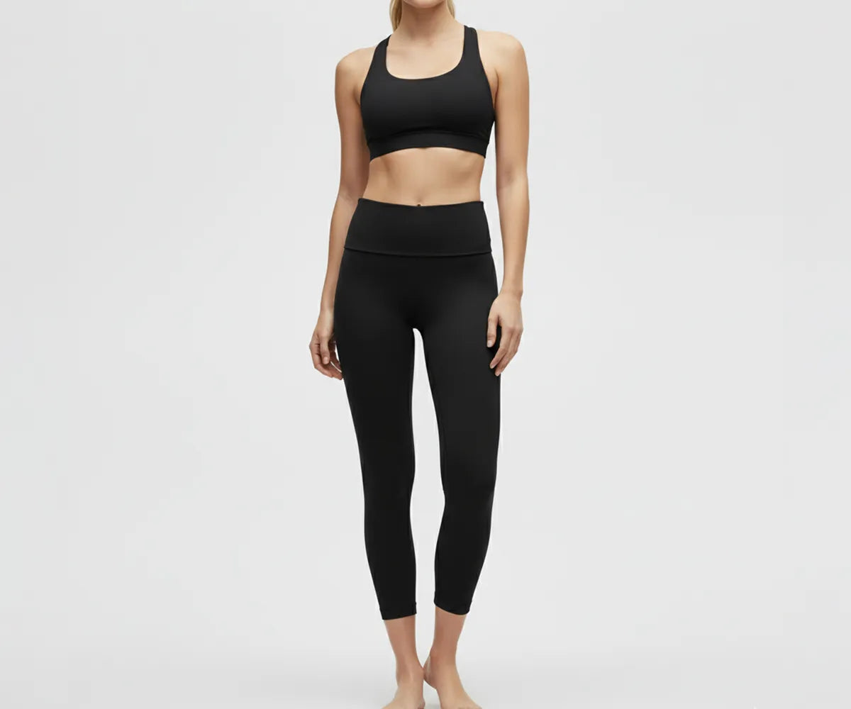 High-waisted black women's leggings for yoga and gym, breathable cotton blend with stretchy, supportive waistband for workouts and everyday wear.